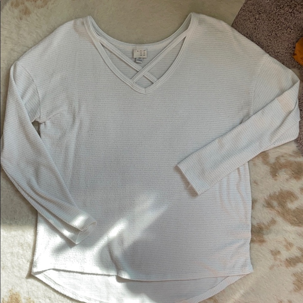 White sweater with silver stripe detail